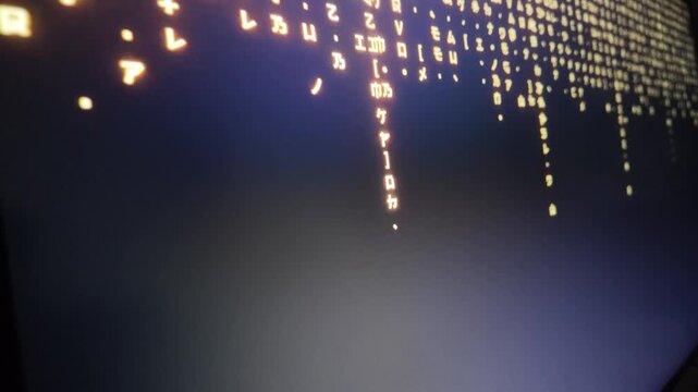 Matrix style raining digital code falling on computer monitor programming