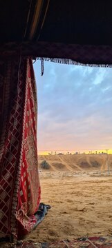 Saudi Bedouin tent with sunset view over sand dunes in Najd desert