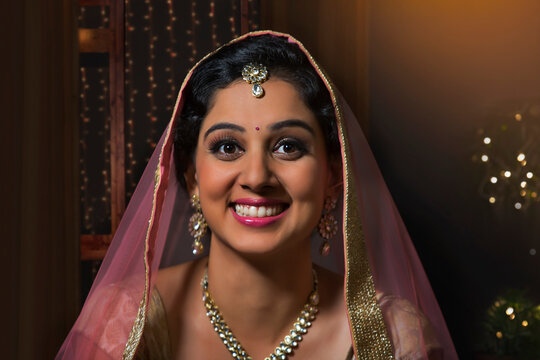 Close-up portrait of  young woman in traditional dress and jewelry