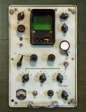 Vintage control panel with knobs and switches