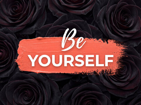 Be Yourself motivational message written on coral paint stroke over black roses