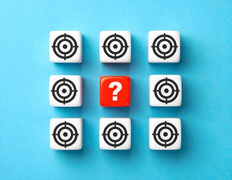 Nine cubes, eight targets & one question mark, arranged on blue background