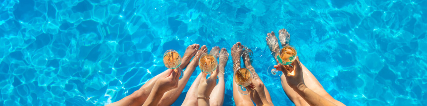 Champagne by the pool. Selective focus.