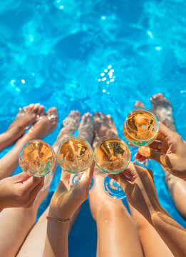 Champagne by the pool. Selective focus.