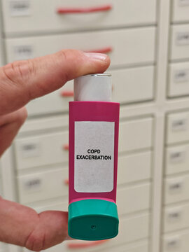 COPD EXACERBATION medical condition or healthcare concept represented by a metered dose inhaler held in front of pharmacy drawers