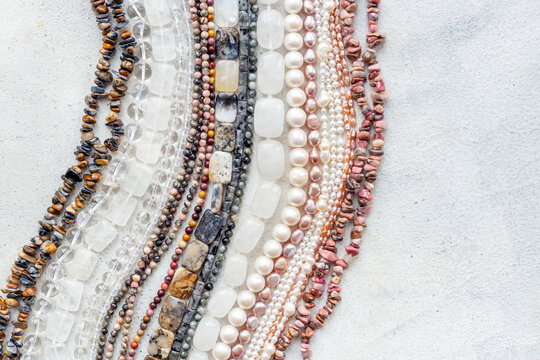 Lots of gemstones and pearls beads for jewelry, top view