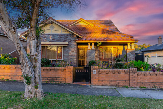 Suburban residential Brick house terracotta roof at sunset in Sydney  NSW Australia 