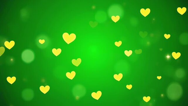 Yellow hearts floating in green bokeh background with gentle camera movement for romantic celebration