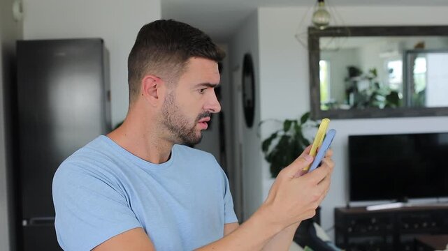 Overwhelmed man managing two smartphones simultaneously during stressful multitask day