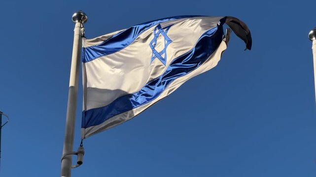 Israeli Flag Waving Against Clear Blue Sky