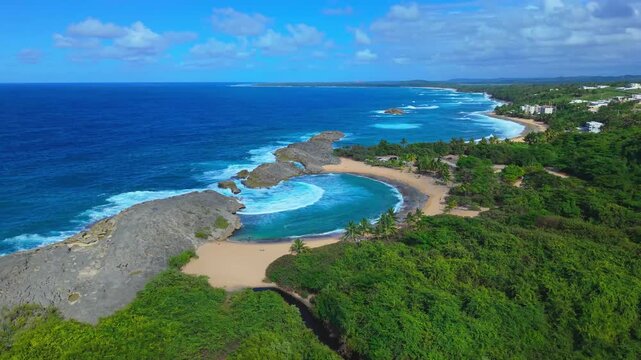 Hovering high above Manat&iacute;, a drone captures the breaking Atlantic waves crashing over the rock barrier at Mar Chiquita Beach.
