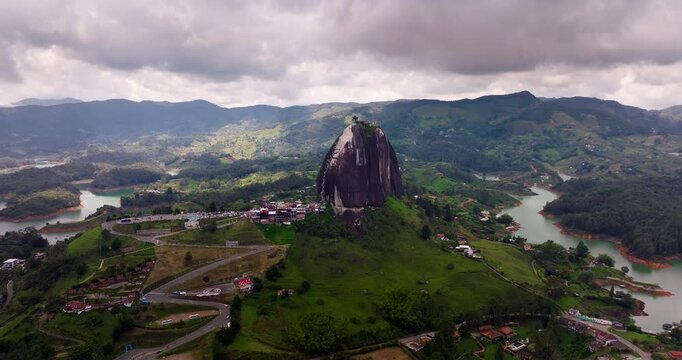 Drone pullback, La Piedra or The Rock of Guatap&eacute; inselberg on lakeshore