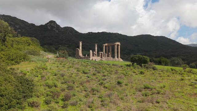Approaching The Temple of Antas Remains, Punic-Roman Archaeological Site In Fluminimaggiore, Sardinia, Italy. Aerial Drone Shot