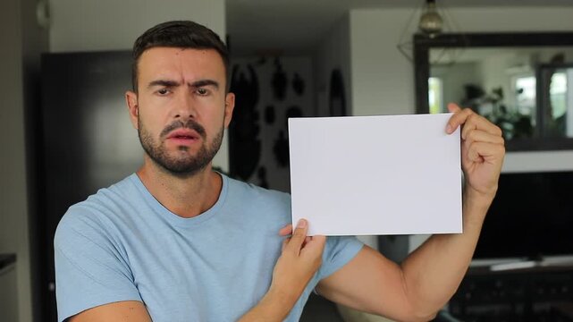 Angry man showing a paper with space for copy