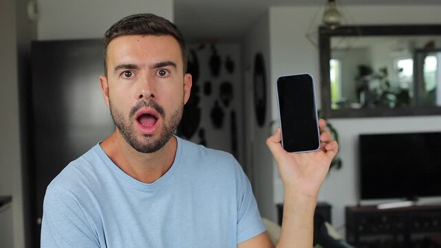 Man sharing something surprising on his mobile phone screen 