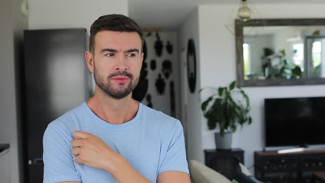 Handsome man gesturing toward side copy space with playful eyebrow raise