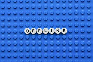 Fototapeta premium Tambov, Russian Federation - August 03, 2026 The word Offline on a blue Lego baseplate. The scene is made out of Lego dots.