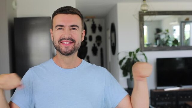 Man warming up and rotating his wrists before a workout.