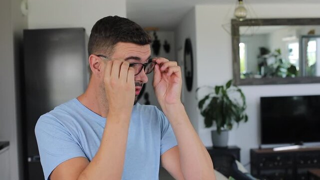 Man trying to see through dirty eyeglasses 