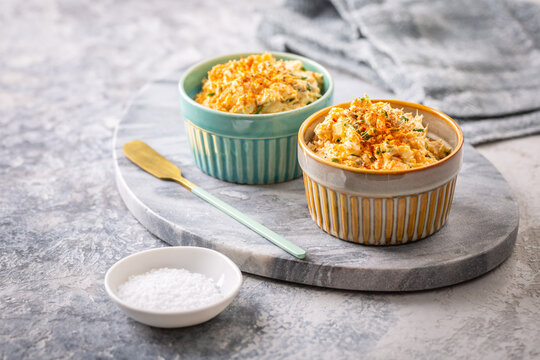 Delicious tuna egg spread with cream cheese and chives served in ramekins