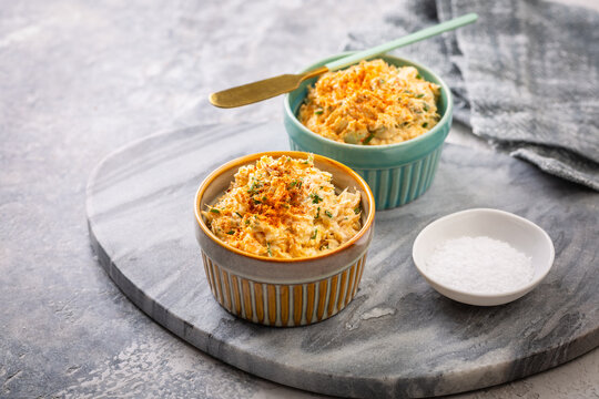 Delicious tuna egg spread with cream cheese and chives served in ramekins