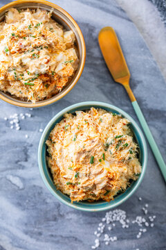 Delicious tuna egg spread with cream cheese and chives served in ramekins