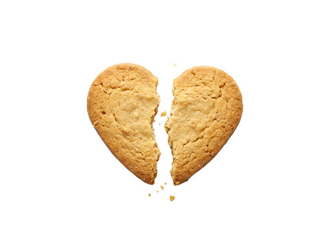 Broken heart shaped cookie. Split biscuit isolated on white background for love concept.
