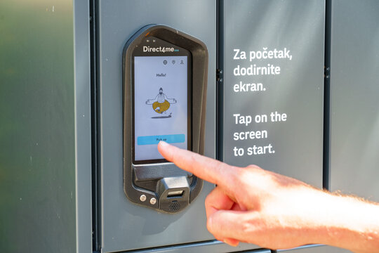 Rijeka, Croatia - June 27, 2026: touchscreen interface on an automated parcel locker to collect a package. Editorial concept of self-service logistics, digital delivery, and contactless technology