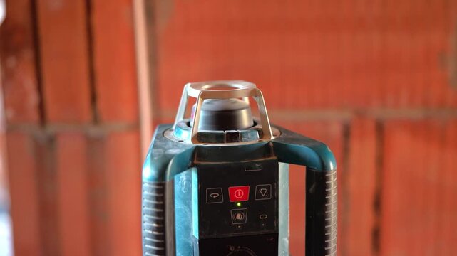 Self-leveling laser level projecting beam