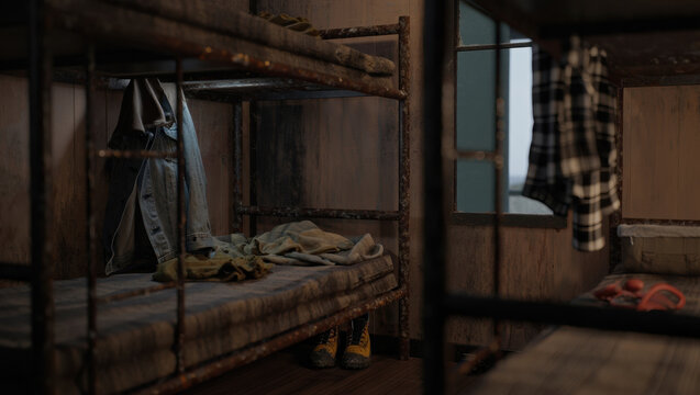 Worn metal bunk beds with scattered clothing and boots in a dim rustic dormitory room, suggesting abandonment or rough living conditions. Moody low-light interior with visible window and ladder.