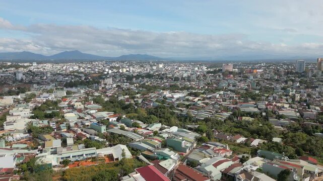 Urban Pleiku City Central Vietnam Drone Track In Over Suburbs High Angle 4K 30FPS