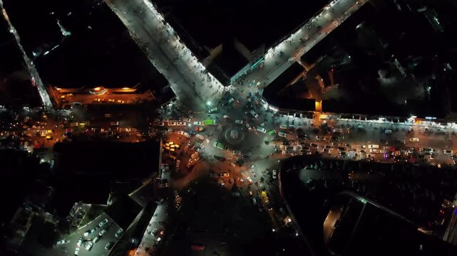 Aerial Night View of Fawara Chowk in Rawalpindi Pakistan Showing Busy Traffic, Illuminated Roads and Urban Activity