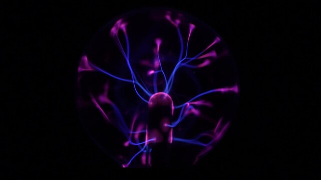 Close-up of the plasma ball in operation. The discharge color is shades of purple.