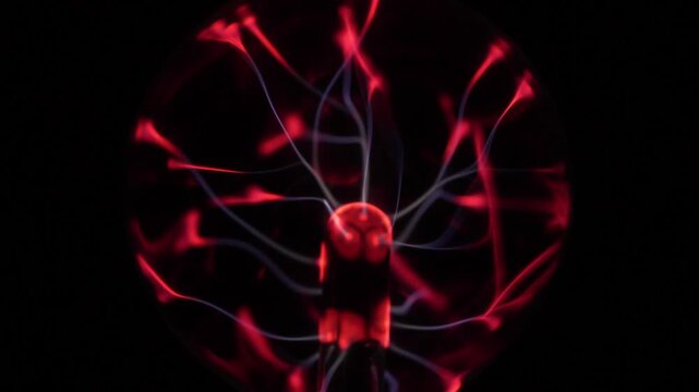 Close-up of the plasma ball during operation. The discharge color is shades of red.