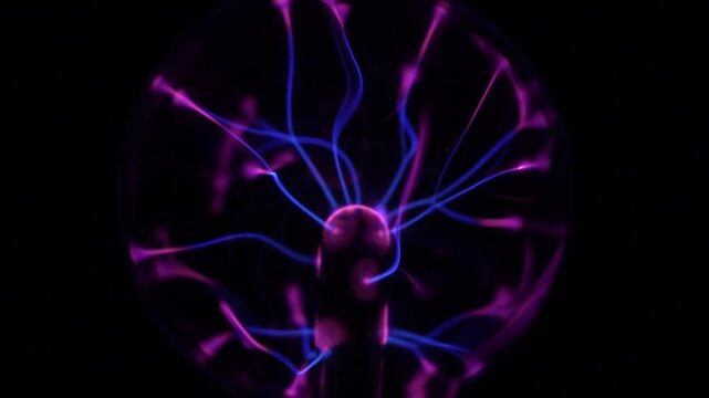 Close-up of the plasma ball in operation. The discharge color is shades of purple.