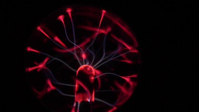 Close-up of the plasma ball during operation. The discharge color is shades of red.