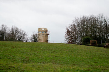 Fototapeta premium Stone Observation Tower Under Renovation on a Hillside in Lansac, France