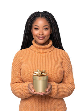 Smiling African American woman with braided hair wearing orange turtleneck sweater holding round gold gift box isolated on transparent or white background, png