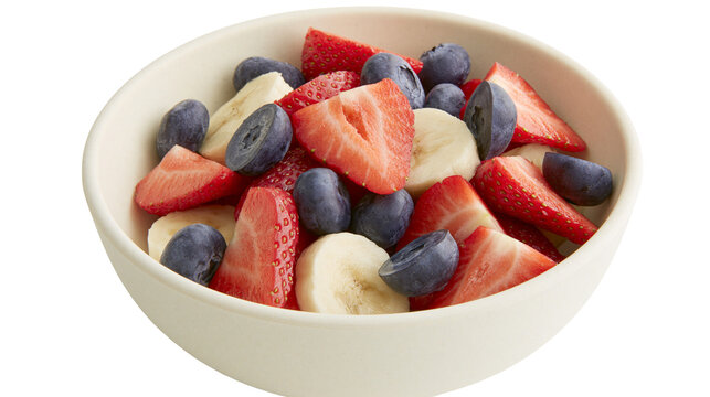 Fresh fruit salad with strawberries blueberries and banana slices, isolated on transparent background
