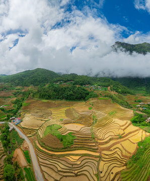 The pouring water season makes the terraced fields of Y Ty, Lao Cai province, Vietnam appear with brown soil blending with the beautiful sky