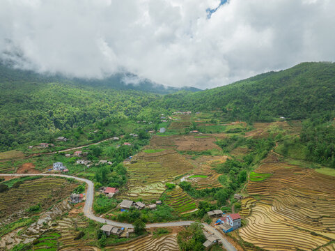 The pouring water season makes the terraced fields of Y Ty, Lao Cai province, Vietnam appear with brown soil blending with the beautiful sky