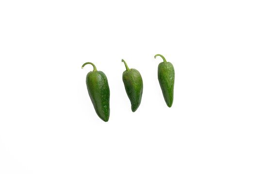 Three, green, jalapeno chili peppers on a white background.