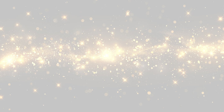 Twinkling golden lights and sparkling particles in a flowing horizontal pattern on a black background on transparent background