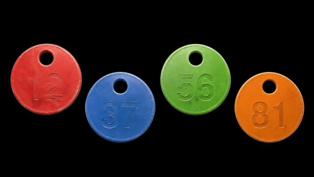 Colored numbered plastic tags isolated on black background