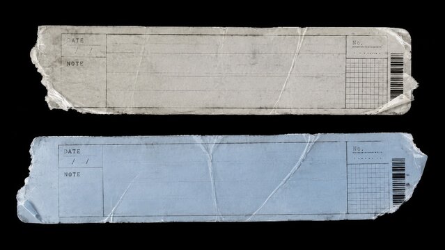 Two torn worn paper labels isolated on black background