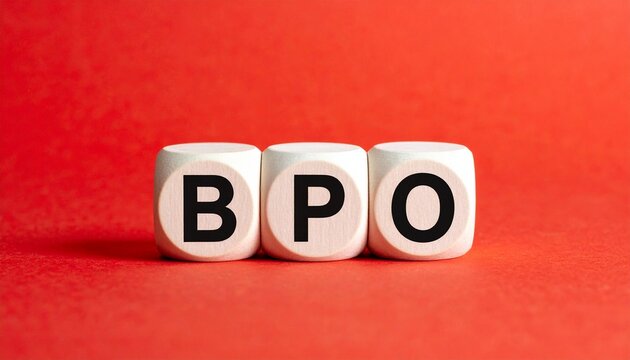 Three white cubes placed side by side against bright red background, each cube printed with single black letter forming acronym &ldquo;BPO,&rdquo; visually symbolizing business process outsourcing, relevant in bu