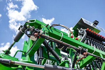 Agricultural field sprayer nozzle body on boom for pesticide application. Modern crop protection machinery engineering component and farming transport equipment closeup details for cultivation. © NastyaPhoto