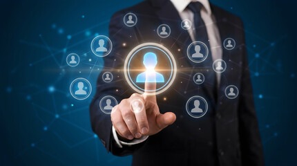 Fototapeta premium A professional selecting a glowing digital employee profile icon for recruitment strategy