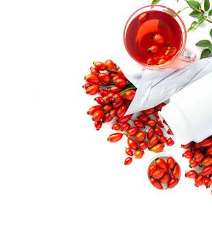 bunch of fresh dog rose, Rosa canina, rosehip rose hips and herbal tea isolated on white background