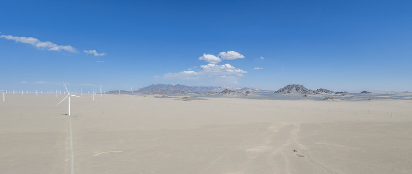 Aerial View Of Wind Farm In Vast Gobi Desert With Heidu Mountain Landscape